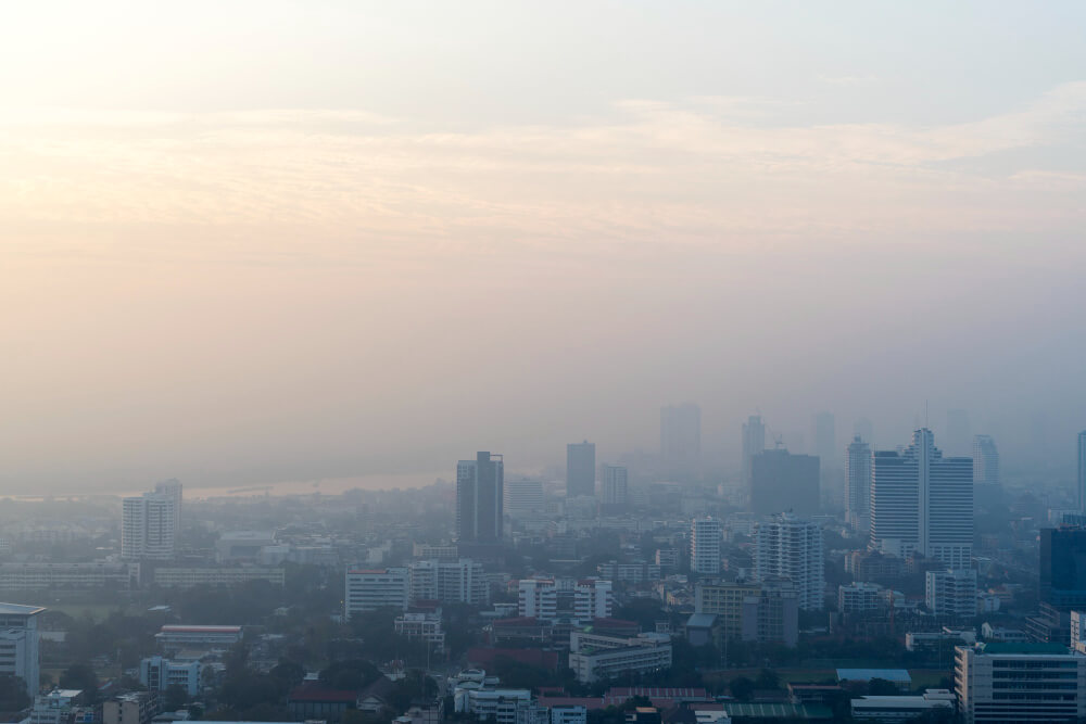 Mildly hazy city skyline representing environmental exposures that can affect sperm development.